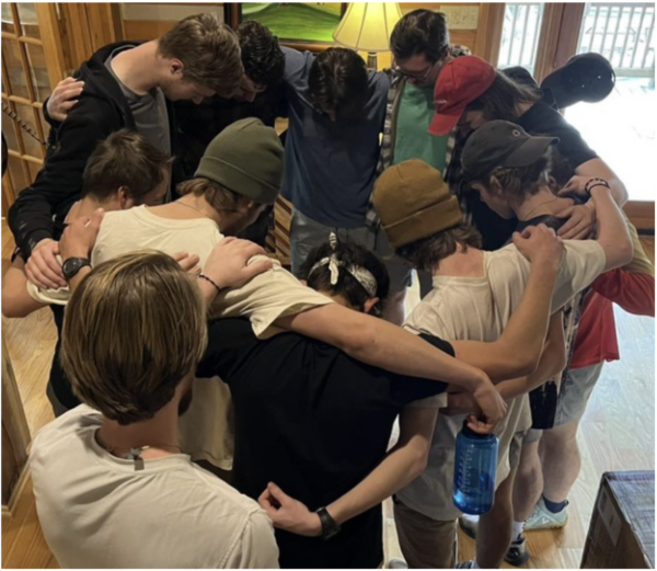 group of men in prayer